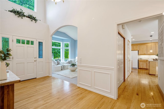 1912 243rd Pl SE, Bothell, WA 98021 - foyer entrance featuring light wood-type flooring, arched walkways, and recessed lighting
