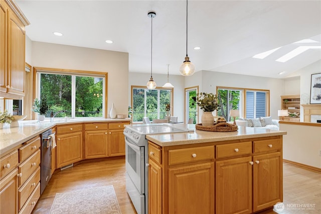 1912 243rd Pl SE, Bothell, WA 98021 - kitchen featuring white electric range oven, a skylight, light wood-style flooring, stainless steel dishwasher, and recessed lighting