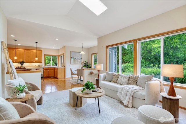 1912 243rd Pl SE, Bothell, WA 98021 - living room with light wood-style floors, recessed lighting, vaulted ceiling, and a skylight
