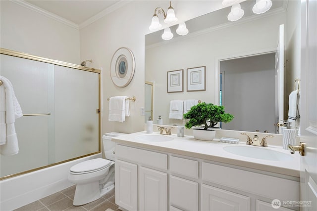 1912 243rd Pl SE, Bothell, WA 98021 - full bathroom featuring double vanity, crown molding, combined bath / shower with glass door, and tile patterned flooring