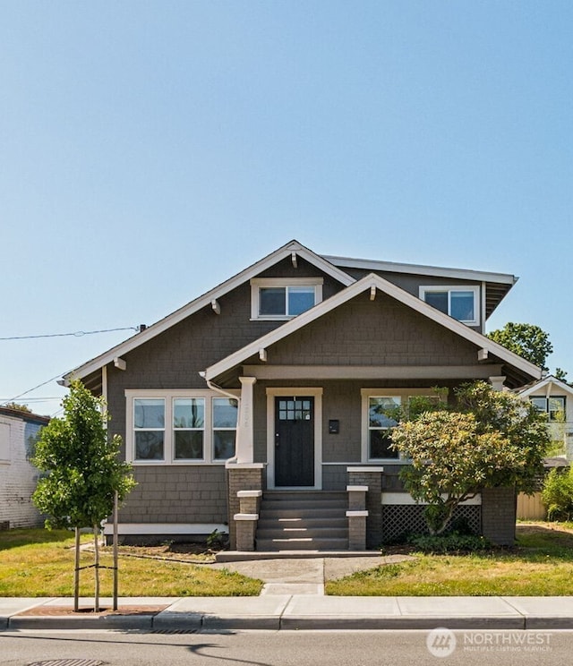 1306 Main St, Sumner, WA 98390 - view of front facade featuring covered porch and a front lawn