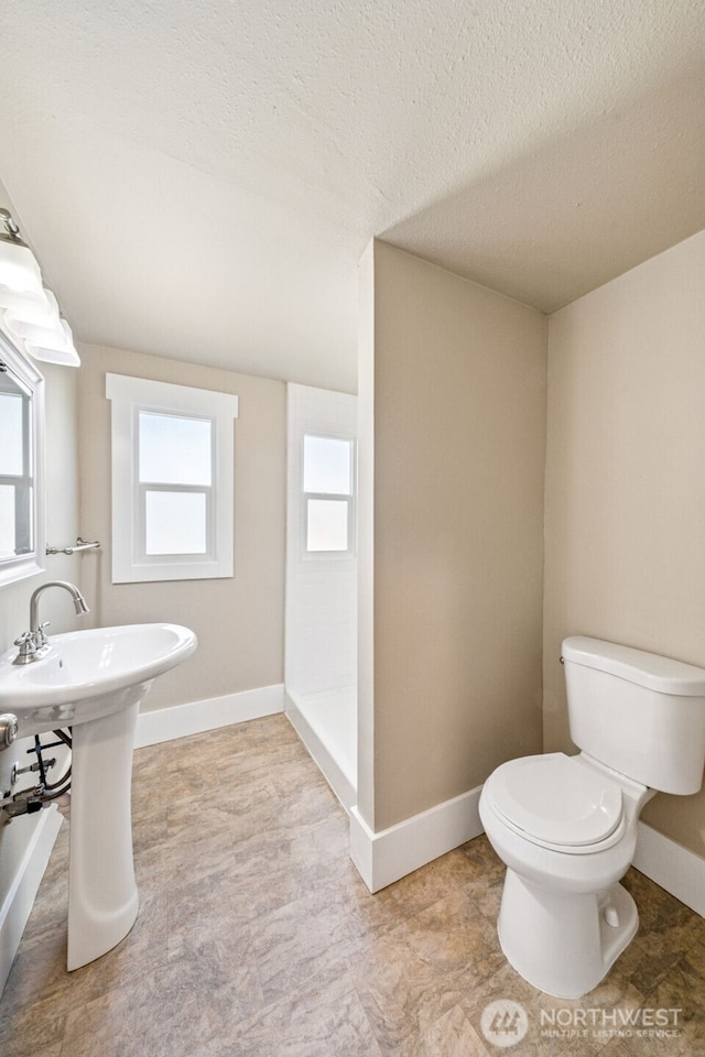 1306 Main St, Sumner, WA 98390 - full bath featuring a shower and a textured ceiling