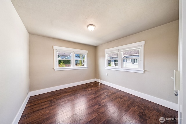 1306 Main St, Sumner, WA 98390 - unfurnished room featuring dark wood finished floors and baseboards