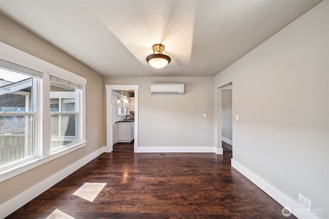 1306 Main St, Sumner, WA 98390 - unfurnished room featuring a wall mounted air conditioner and wood finished floors