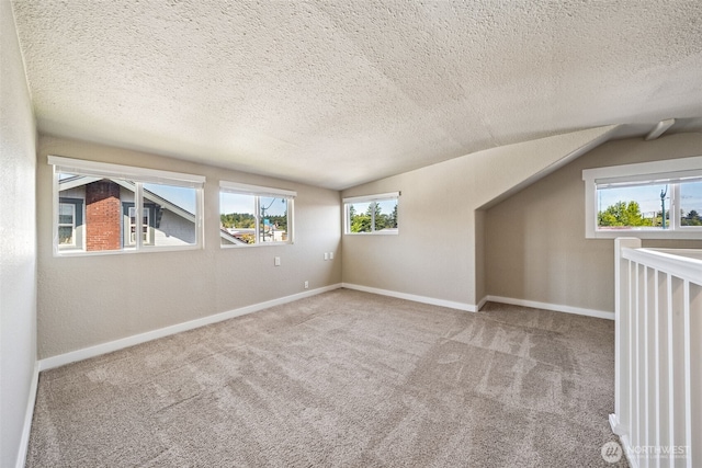 1306 Main St, Sumner, WA 98390 - bonus room featuring a textured ceiling, vaulted ceiling, and carpet flooring