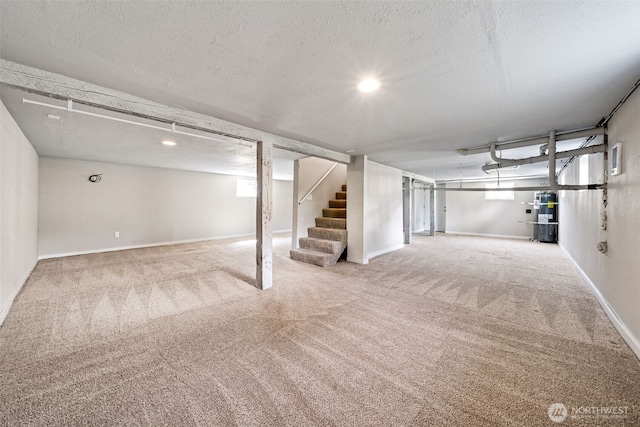 1306 Main St, Sumner, WA 98390 - finished below grade area with carpet, stairway, secured water heater, and a textured ceiling