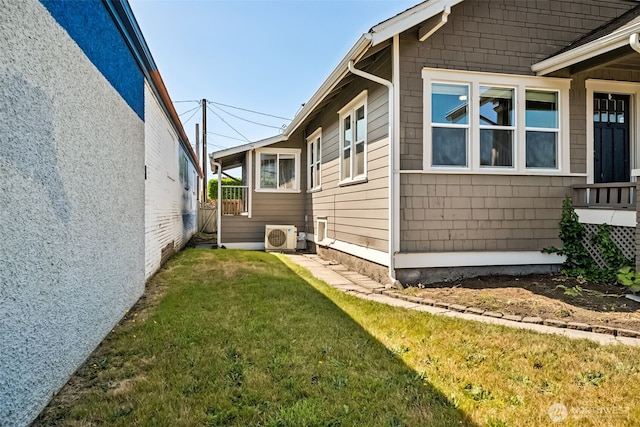 1306 Main St, Sumner, WA 98390 - view of side of property with a cooling unit and a lawn
