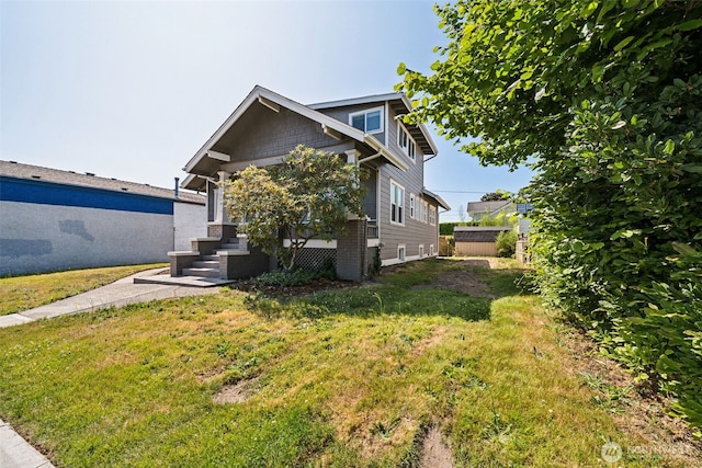 1306 Main St, Sumner, WA 98390 - view of home's exterior with a yard