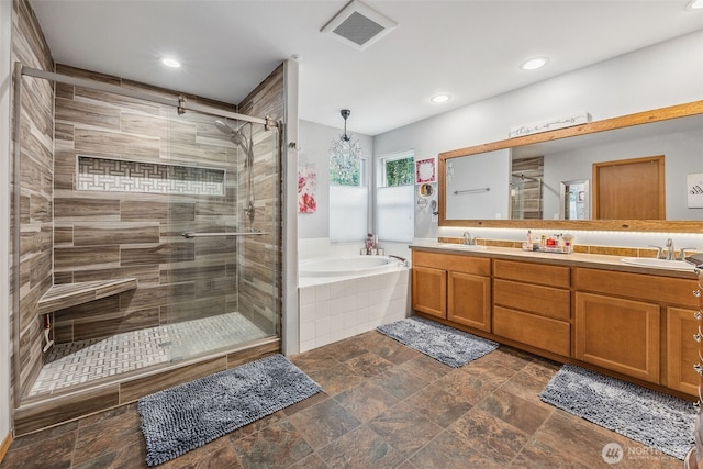 8316 230th Street Ct E, Graham, WA 98338 - full bath featuring a bath, a shower stall, double vanity, and recessed lighting