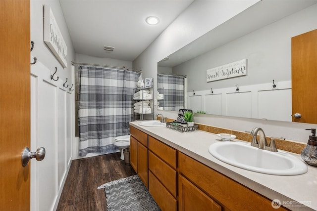 8316 230th Street Ct E, Graham, WA 98338 - bathroom with double vanity and wood finished floors