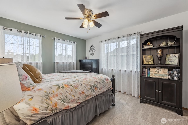 8316 230th Street Ct E, Graham, WA 98338 - bedroom featuring multiple windows, light colored carpet, and ceiling fan