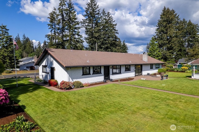 9802 124th St E, Puyallup, WA 98373 - single story home with a front lawn, a tile roof, a chimney, and stucco siding