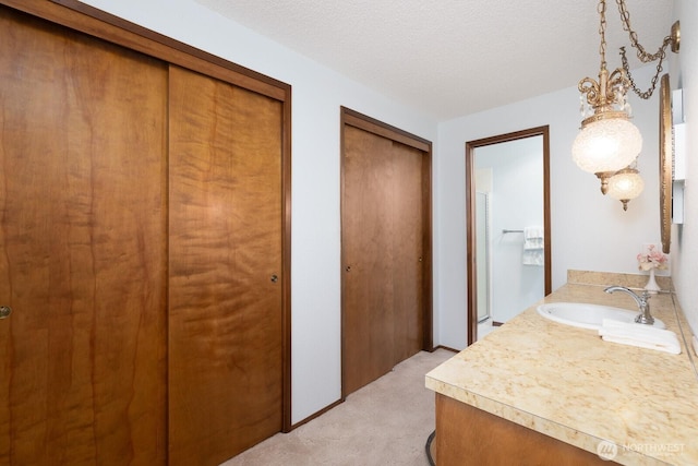 9802 124th St E, Puyallup, WA 98373 - bathroom featuring vanity and a textured ceiling