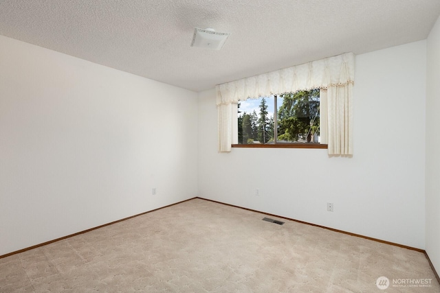 9802 124th St E, Puyallup, WA 98373 - carpeted spare room with baseboards and a textured ceiling