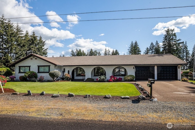 9802 124th St E, Puyallup, WA 98373 - single story home with stucco siding, a garage, a front yard, a tile roof, and driveway