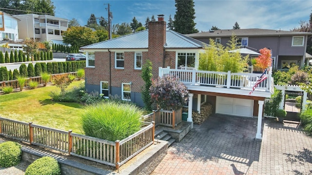 141 18th Ave, Kirkland, WA 98033 - rear view of house with an attached garage, a chimney, driveway, a metal roof, and brick siding