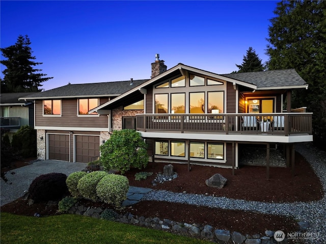 6210 105th Ave NE, Kirkland, WA 98033 - back of house at dusk featuring a garage, a chimney, concrete driveway, and a shingled roof