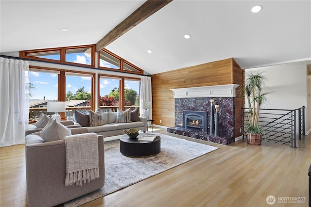 6210 105th Ave NE, Kirkland, WA 98033 - living room featuring wood finished floors, a premium fireplace, wooden walls, and recessed lighting