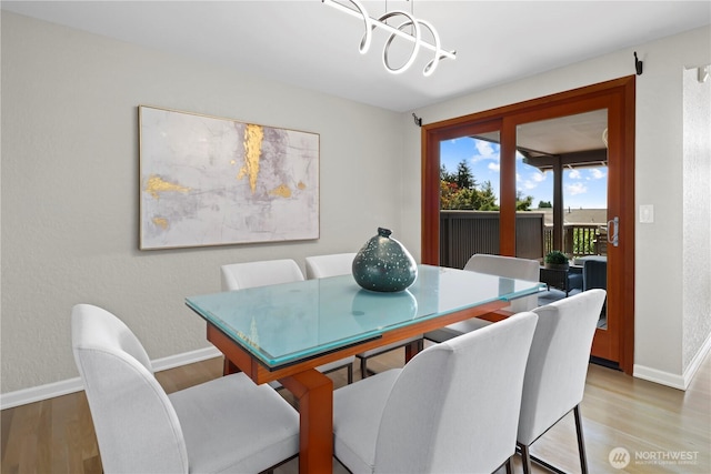 6210 105th Ave NE, Kirkland, WA 98033 - dining area with a chandelier and light wood-style flooring