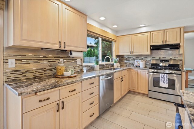 6210 105th Ave NE, Kirkland, WA 98033 - kitchen with appliances with stainless steel finishes, light brown cabinetry, under cabinet range hood, tasteful backsplash, and stone countertops