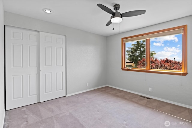6210 105th Ave NE, Kirkland, WA 98033 - unfurnished bedroom with light colored carpet, a closet, and ceiling fan