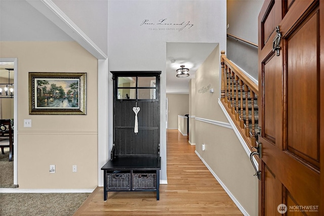 1920 11th Street Pl SW, Puyallup, WA 98371 - foyer with stairs, light wood finished floors, and a chandelier