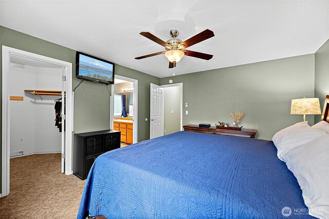 1920 11th Street Pl SW, Puyallup, WA 98371 - carpeted bedroom with a walk in closet, a ceiling fan, a closet, and ensuite bath