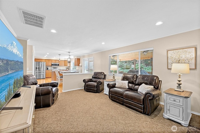 1920 11th Street Pl SW, Puyallup, WA 98371 - living room with crown molding, recessed lighting, and light carpet
