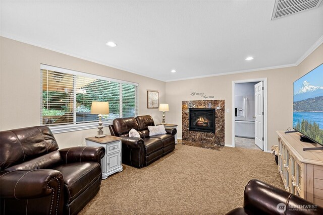 1920 11th Street Pl SW, Puyallup, WA 98371 - living area with light carpet, ornamental molding, recessed lighting, and a premium fireplace
