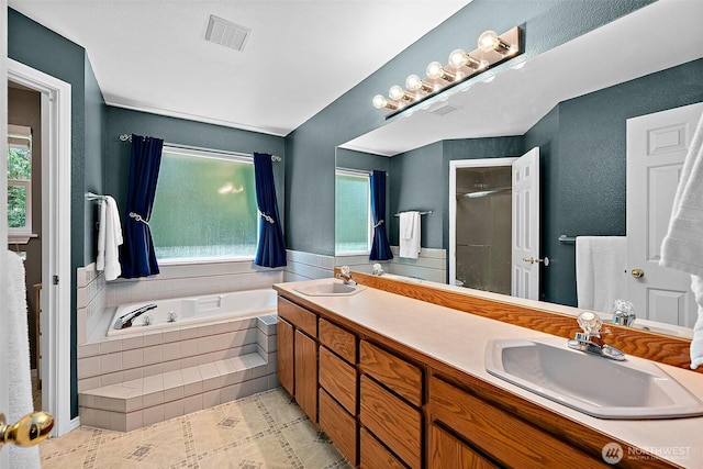 1920 11th Street Pl SW, Puyallup, WA 98371 - bathroom featuring healthy amount of natural light, a bath, double vanity, and tile patterned flooring