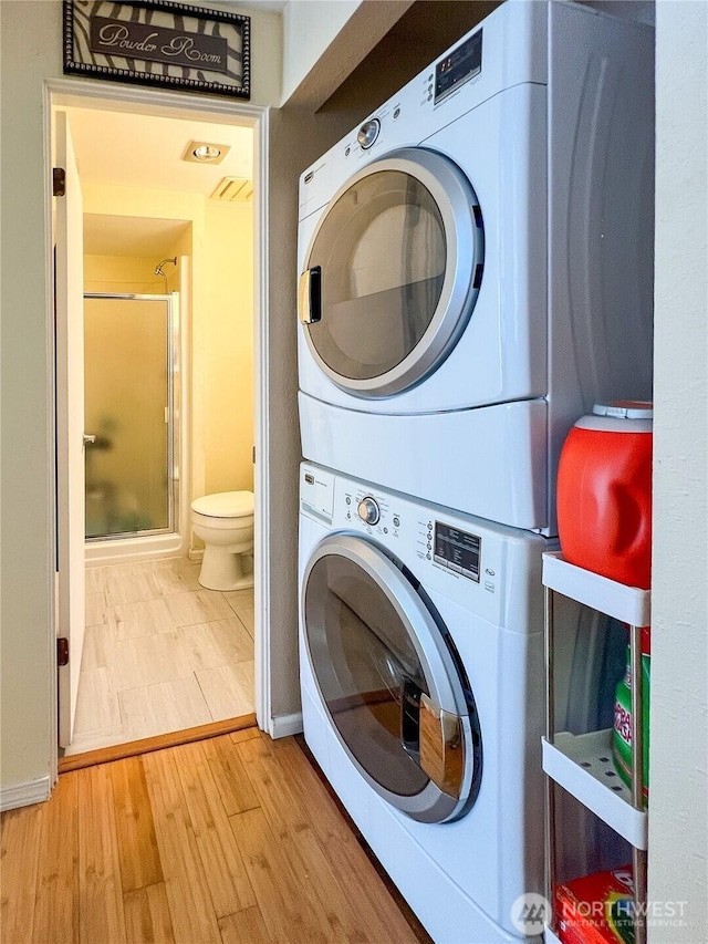 7806 Birch Bay Dr Unit 501, Blaine, WA 98230 - laundry room with estacked washer and dryer and wood finished floors