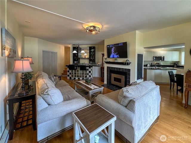 7806 Birch Bay Dr Unit 501, Blaine, WA 98230 - living room with light wood-type flooring and a tiled fireplace