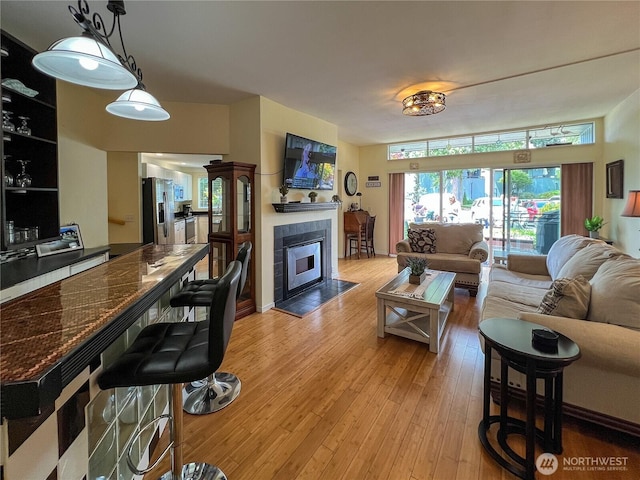 7806 Birch Bay Dr Unit 501, Blaine, WA 98230 - living area with light wood finished floors and a tiled fireplace