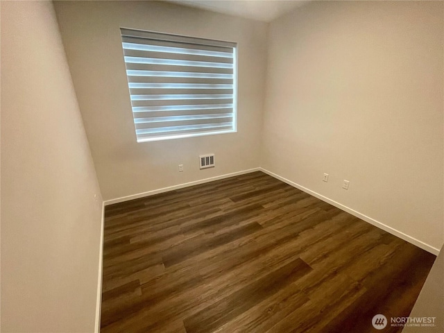 2129 Lancaster Way, Ferndale, WA 98248 - spare room featuring baseboards and dark wood-style floors