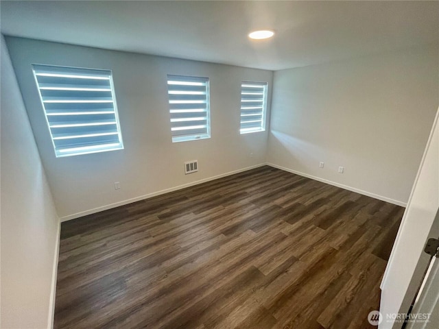 2129 Lancaster Way, Ferndale, WA 98248 - unfurnished room with dark wood-type flooring and baseboards