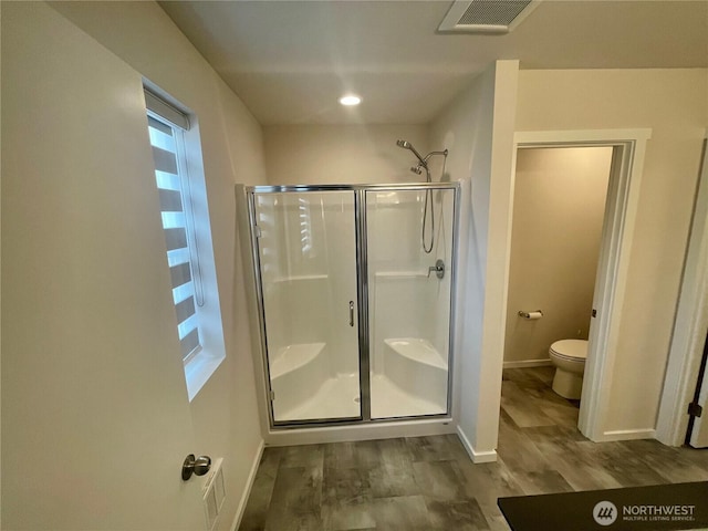 2129 Lancaster Way, Ferndale, WA 98248 - full bathroom featuring a stall shower, wood finished floors, and recessed lighting