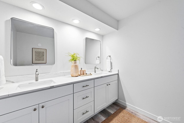 17805 NE 29th St, Redmond, WA 98052 - full bathroom featuring double vanity, wood finished floors, and recessed lighting