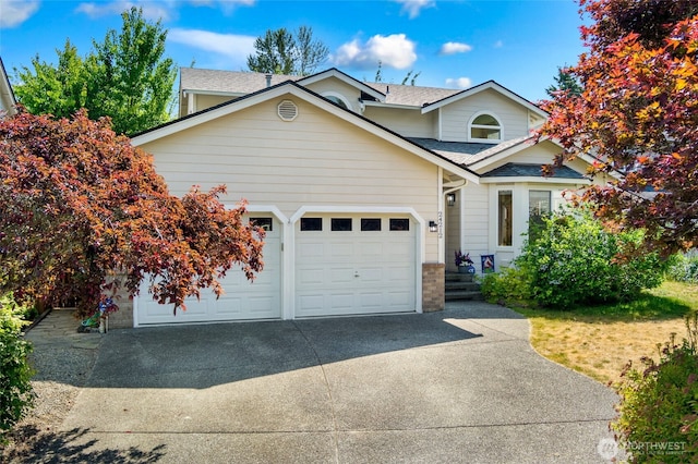 24212 13th Pl W, Bothell, WA 98021 - traditional home with concrete driveway, roof with shingles, an attached garage, and brick siding