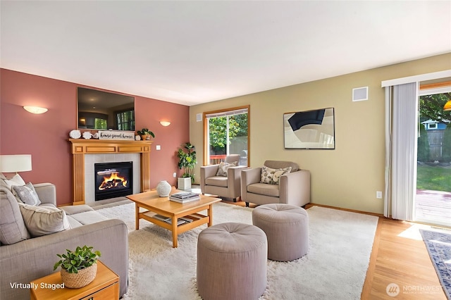 24212 13th Pl W, Bothell, WA 98021 - living room featuring light wood-style flooring and a fireplace
