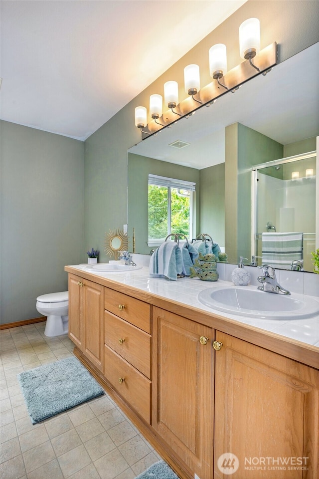 24212 13th Pl W, Bothell, WA 98021 - full bathroom with double vanity, a stall shower, and tile patterned flooring