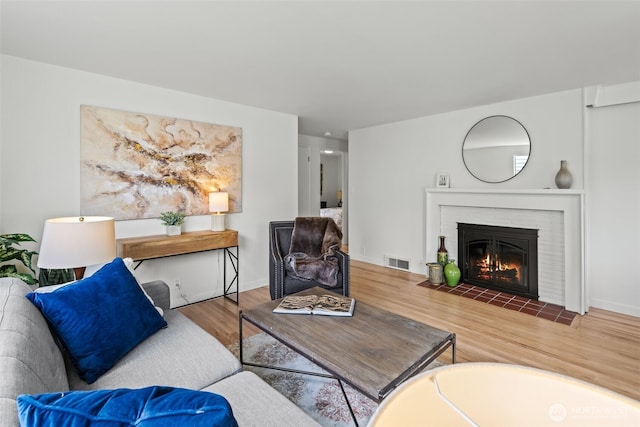 5065 SW Olga St, Seattle, WA 98116 - living area with wood finished floors and a fireplace