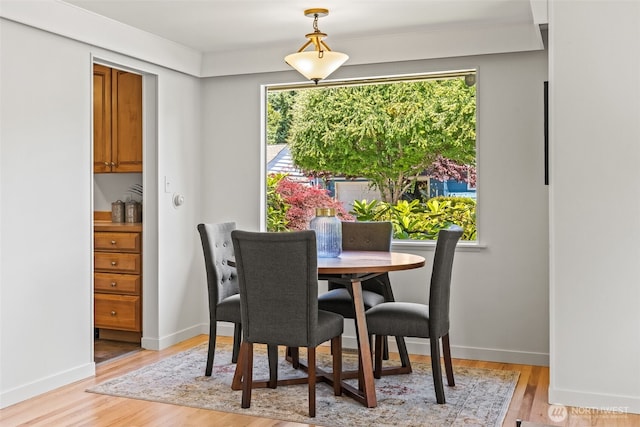 5065 SW Olga St, Seattle, WA 98116 - dining area with light wood-style flooring and plenty of natural light