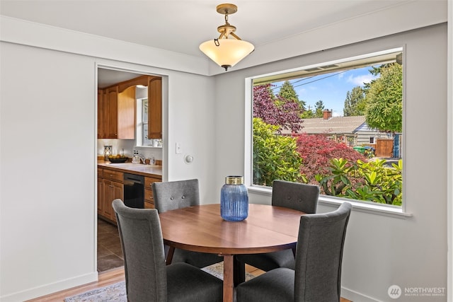 5065 SW Olga St, Seattle, WA 98116 - dining space with healthy amount of natural light and light wood-style flooring