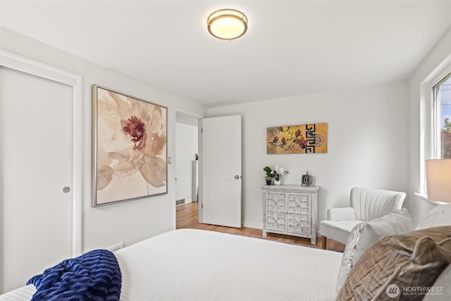 5065 SW Olga St, Seattle, WA 98116 - bedroom featuring wood finished floors