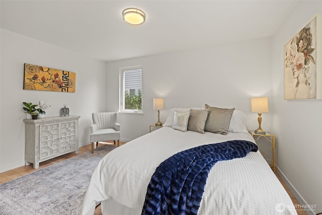 5065 SW Olga St, Seattle, WA 98116 - bedroom featuring wood finished floors and baseboards