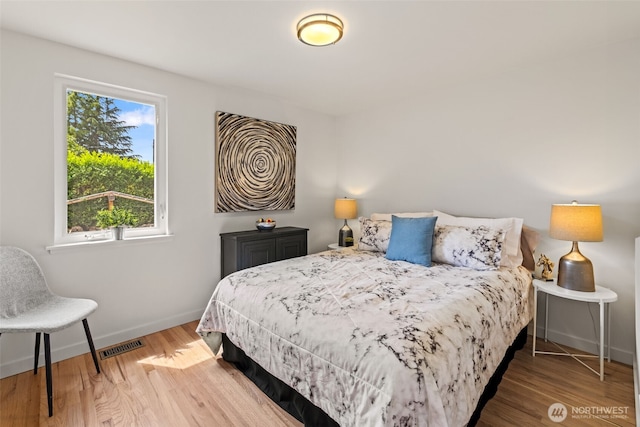 5065 SW Olga St, Seattle, WA 98116 - bedroom featuring wood finished floors