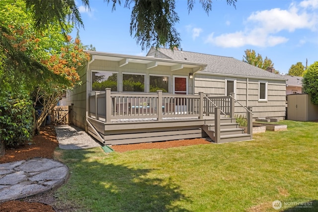 5065 SW Olga St, Seattle, WA 98116 - rear view of house with a wooden deck and roof with shingles