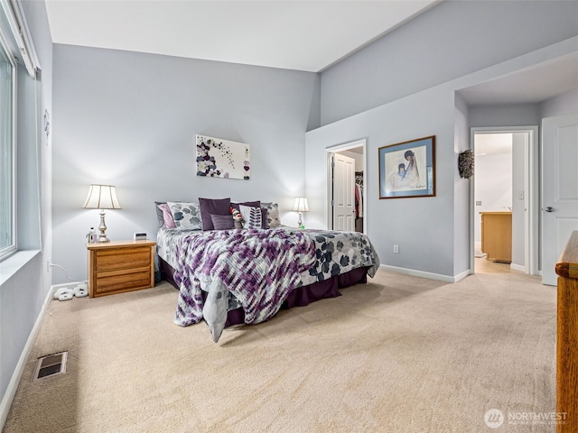 5909 Panorama Dr SE Unit 8-101, Auburn, WA 98092 - bedroom featuring carpet floors, a walk in closet, connected bathroom, a closet, and lofted ceiling