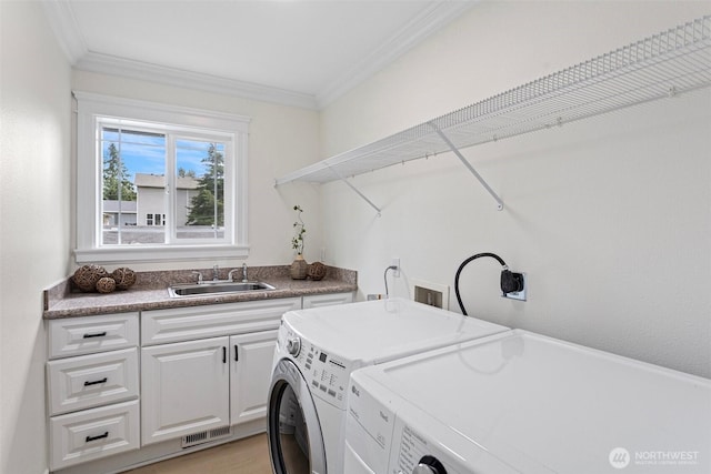 15006 Old Manor Way, Lynnwood, WA 98087 - washroom with cabinet space, crown molding, and washing machine and dryer