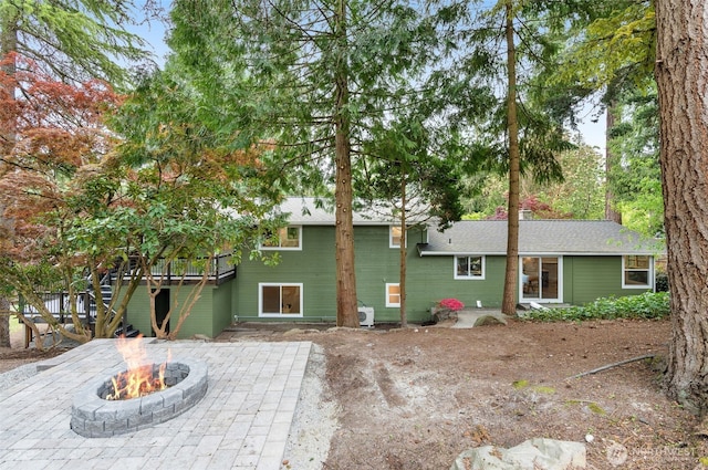 107 219th Pl SE, Bothell, WA 98021 - rear view of house with an outdoor fire pit, a patio, and a wooden deck